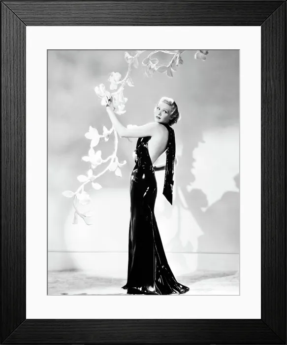 Framed Print : THE CASE AGAINST MRS. AMES, Madeleine Carroll, in a black lacquered satin gown with pink camellia corsage by Helen Taylor, 1936