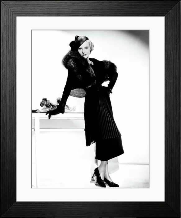 Framed Print : THE CASE AGAINST MRS. AMES, Madeleine Carroll, in a pleated tunic suit trimmed in fox by Helen Taylor, 1936