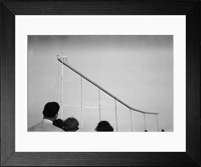 Framed Print : Daredevil preparing to dive into water from cycle down an elevated incline, by Lee Russell, state fair, Donaldsonville, Louisiana, November, 1938 Framed Print : Daredevil preparing to dive into water from cycle down an elevated incline, by Lee Russell, state fair, Donaldsonville, Louisiana, November, 1938