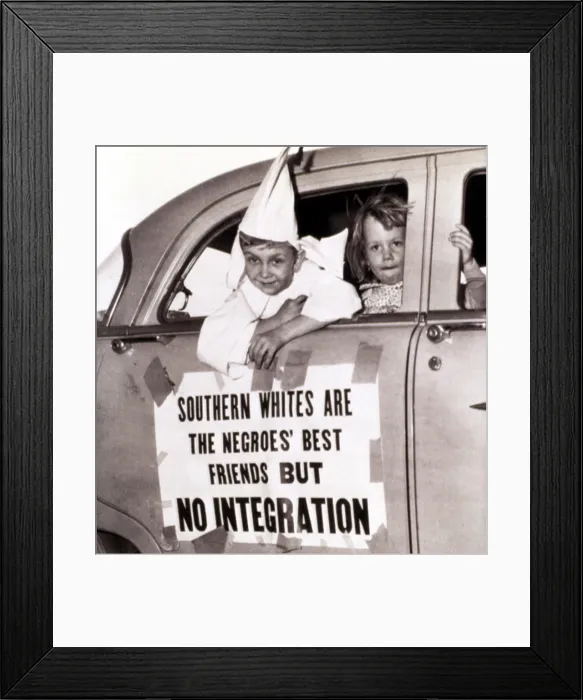 Framed Print : 4 / 14 / 56--MACON, GEORGIA: Perry Blevens, age 7, all decked out in his Ku Klux Klansman robes, rides in the motorcade staged here by the KKK 4 / 14 Framed Print : 4 / 14 / 56--MACON, GEORGIA: Perry Blevens, age 7, all decked out in his Ku Klux Klansman robes, rides in the motorcade staged here by the KKK 4 / 14
