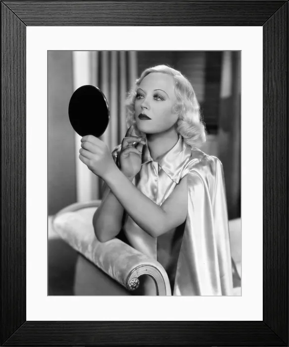 Framed Print : CAIN AND MABEL, Marion Davies checks her makeup on-set, 1936