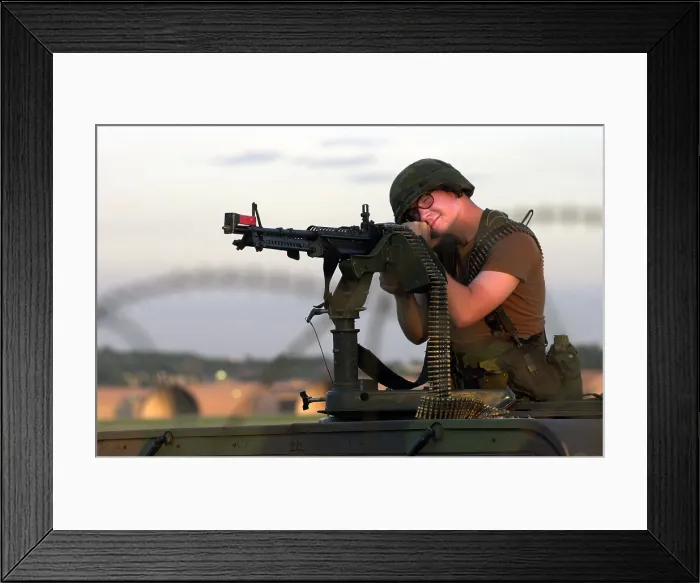 Framed Print : An airman mans a M-60 machine gun at a defensive firing position during training maneuvers at Osan Air Base, Republic of Korea, 7 / 26 / 2001