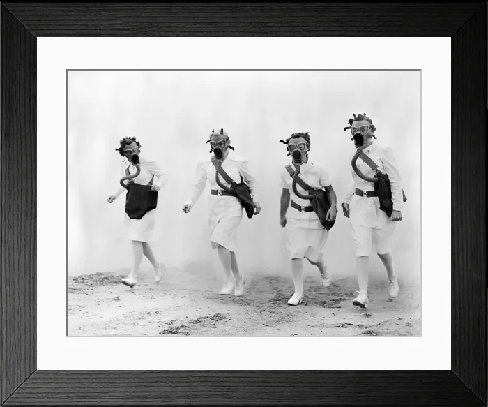 Framed Print : Nurses in gas masks walk through a cloud of smoke in a training drill of the U.S. Army Air Forces Technical Training Command, 1942
