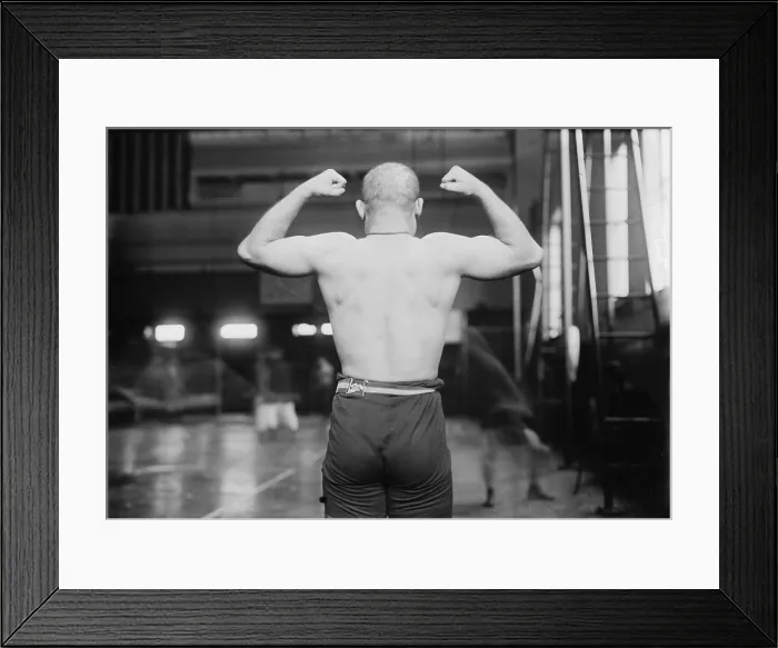 Framed Print : Strong man flexing muscles, Yussif Mahmout, photograph, circa 1900s-1920s