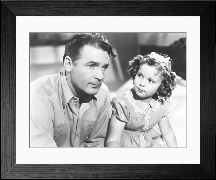 Framed Print : JUST AROUND THE CORNER, from left, Charles Farrell, Shirley Temple, 1938, TM & Copyright 20th Century Fox Film Corp. / courtesy Everett Collection