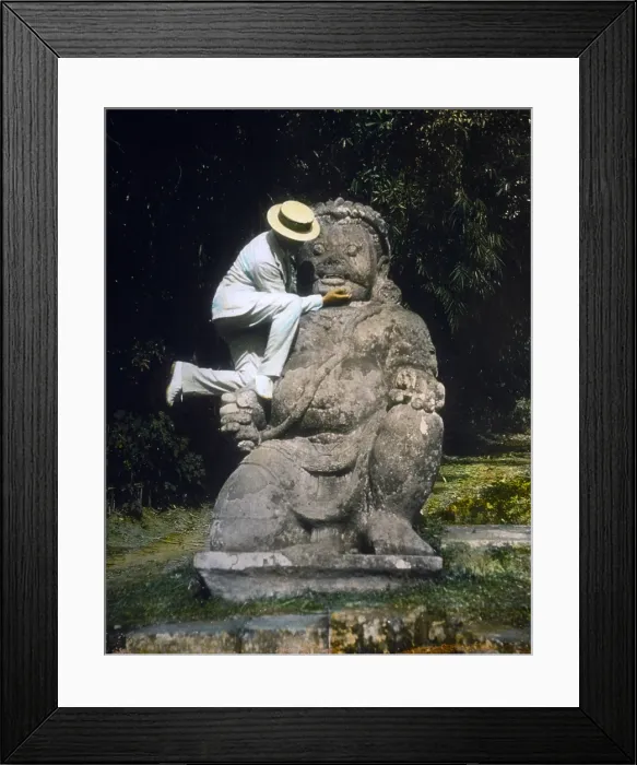 Framed Print : Indonesia, man in straw hat standing on Buddhist idol at ruins of Borobudur, hand colored lantern slide, photograph by William Henry Jackson, 1895 Framed Print : Indonesia, man in straw hat standing on Buddhist idol at ruins of Borobudur, hand colored lantern slide, photograph by William Henry Jackson, 1895
