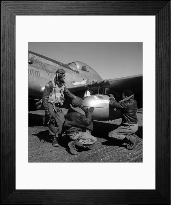 Framed Print : A Tuskegee fighter pilot and two airmen adjusting an external seventy-five gallon drop tank on the wing of a P-51D Mustang, Ramitelli, Italy, March 1945 Framed Print : A Tuskegee fighter pilot and two airmen adjusting an external seventy-five gallon drop tank on the wing of a P-51D Mustang, Ramitelli, Italy, March 1945