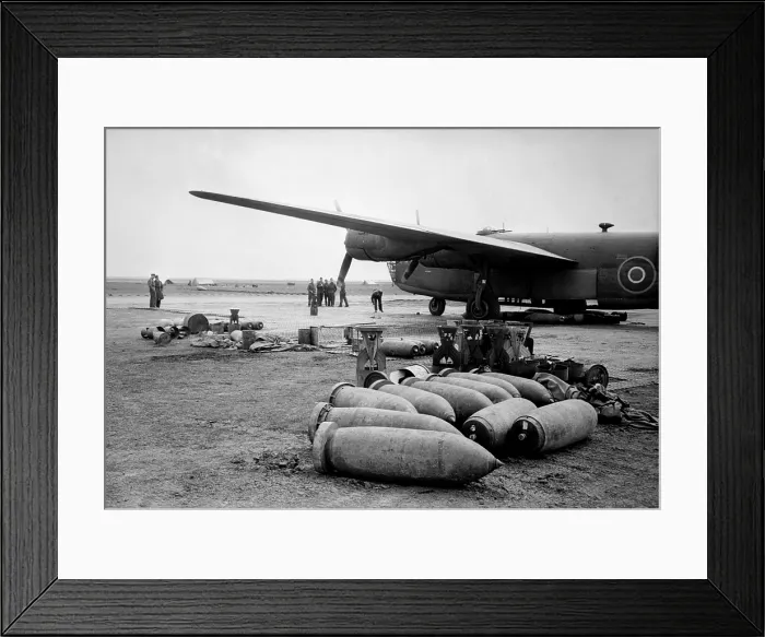 Framed Print : Bombs lie on an Allied airfield ready to be loaded into Royal Air Force Liberators