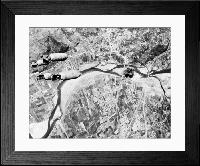 Framed Print : Bombs hurtle toward a Nazi highway bridge. With their rail and shipping facilities almost completely disrupted, the Germans were forced to resort to motor transport Framed Print : Bombs hurtle toward a Nazi highway bridge. With their rail and shipping facilities almost completely disrupted, the Germans were forced to resort to motor transport