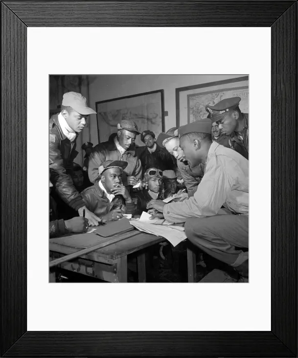 Framed Print : Preflight briefing of several Tuskegee airmen at Ramitelli, Italy, March 1945. Photograph by Toni Frissell