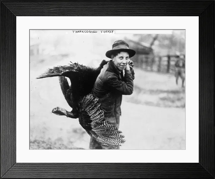 Framed Print : Young man with Thanksgiving turkey, circa 1910s Framed Print : Young man with Thanksgiving turkey, circa 1910s