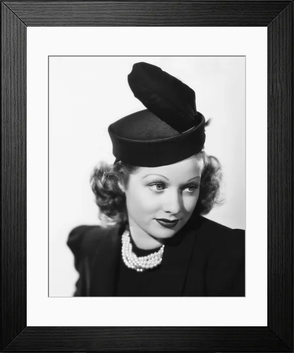 Framed Print : BEAUTY FOR THE ASKING, Lucille Ball, modeling a black felt pillbox hat with feather, 1939