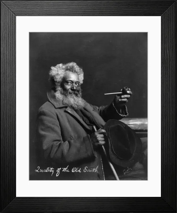 Framed Print : Smoking, original title: Quality of the old South, elderly, bearded, African American man, seated, holding hat and smoke pipe, photograph, 1903 Framed Print : Smoking, original title: Quality of the old South, elderly, bearded, African American man, seated, holding hat and smoke pipe, photograph, 1903