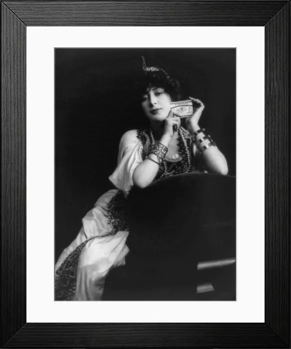 Framed Print : Smoking, woman holding package of cigarettes, Advertisement for Egyptian Deities cigarettes, photograph, 1903