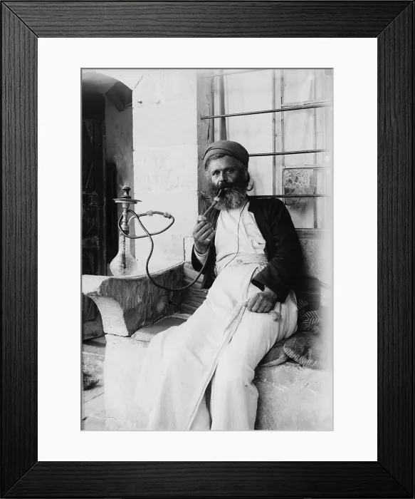 Framed Print : The Samaritans of Nablus (Shechhem). A Samaritan smoking the narghileh, photograph, 1900-1920