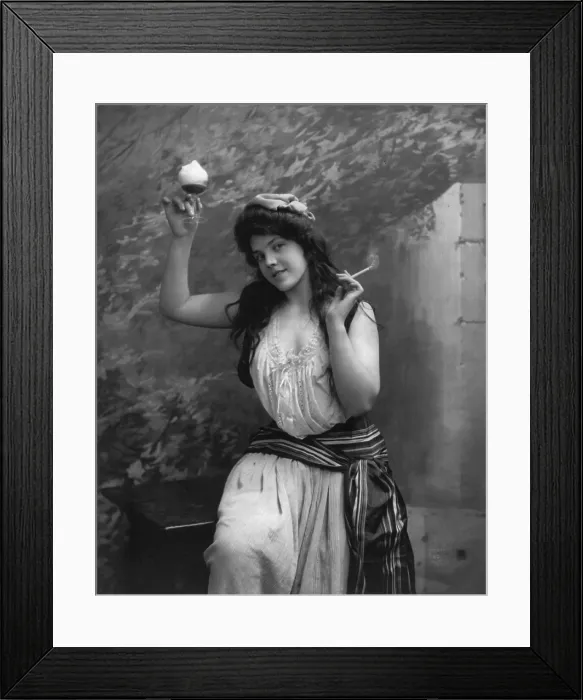 Framed Print : Young woman holding cigarette and drinking glass, photograph by Fritz W. Guerin, 1902