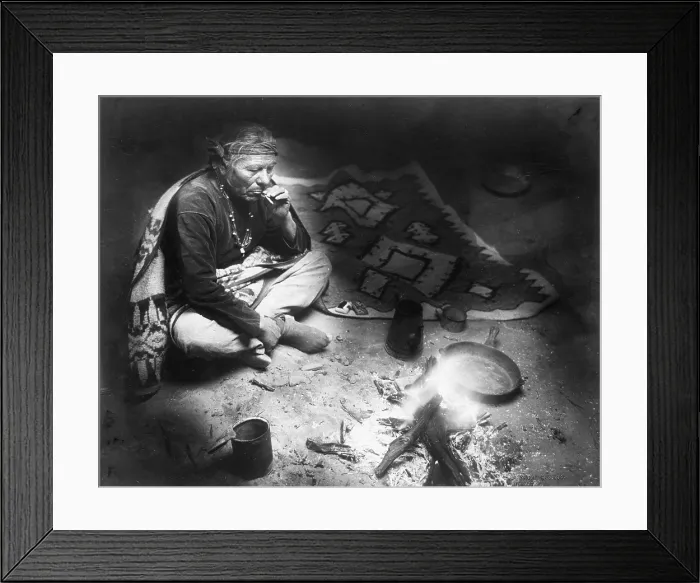 Framed Print : After dinner smoke, Navajo Indian, seated by campfire, smoking cigarette, photograph by William J. Carpenter, 1915