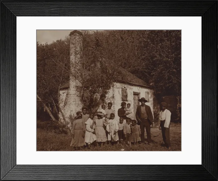 Framed Print : A large African Americans family posed outside former slave quarters at Hermitage Plantation where they still lived in 1907 Framed Print : A large African Americans family posed outside former slave quarters at Hermitage Plantation where they still lived in 1907