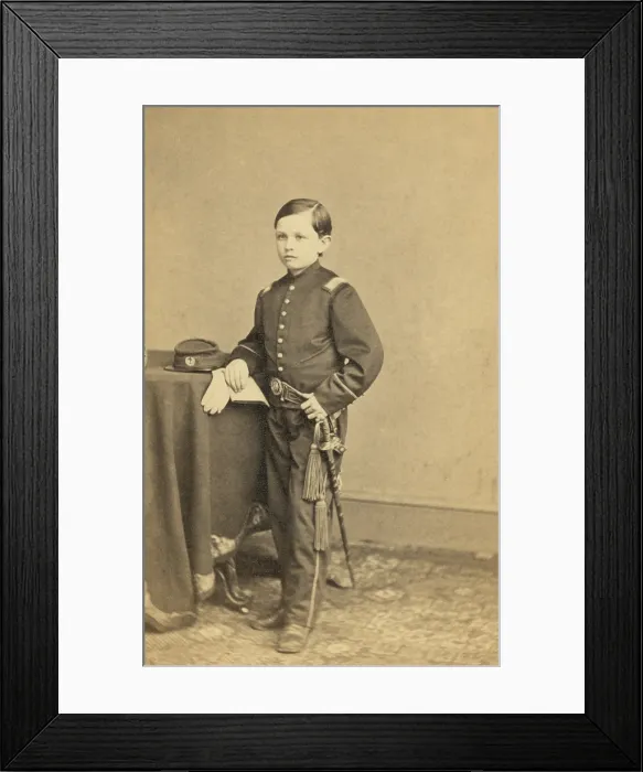 Framed Print : Thomas Tad Lincoln (1853-1871), youngest son of President Abraham and Mary Lincoln wearing a military style uniform. Ca. 1863. Portrait by Mathew Brady