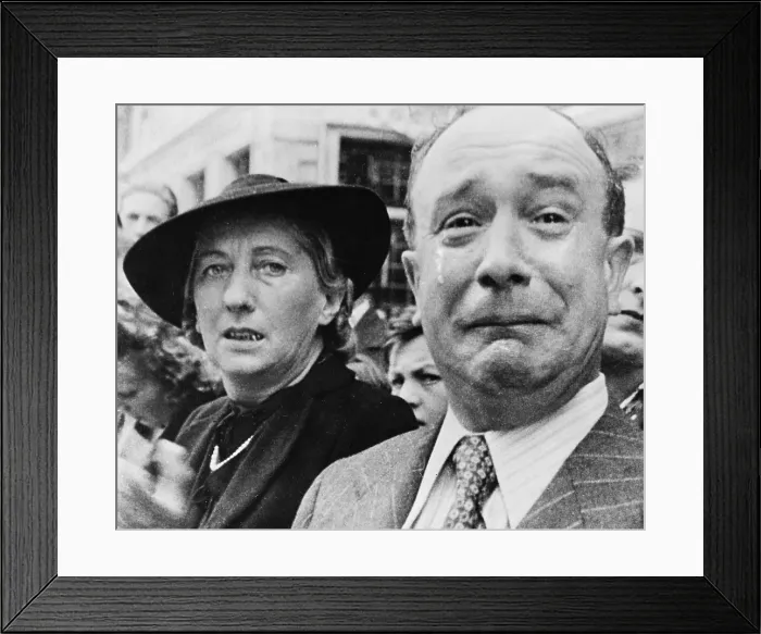 Framed Print : Original caption: A Frenchman weeps as German soldiers march into the French capital, Paris, on June 14, 1940 Framed Print : Original caption: A Frenchman weeps as German soldiers march into the French capital, Paris, on June 14, 1940