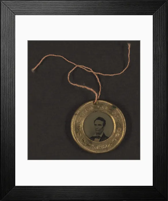 Framed Print : Campaign button for 1860 presidential election showing bust tintype portrait of Abraham Lincoln in a metal casing