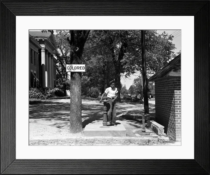 Framed Print : African American boy at a water fountain, the sign reads Colored, original caption: Drinking fountain on the county courthouse lawn, Halifax, North Carolina