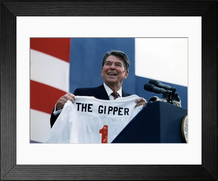 Framed Print : Ronald Reagan. President Reagan holding a Gipper jersey at a Reagan-Bush Rally in New York, 1984