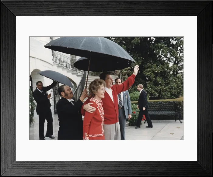Framed Print : President Ronald Reagan and First Lady Nancy Reagan wave from the White House after President Reagan's return from the hospital. Washington, D.C. April 11, 1981