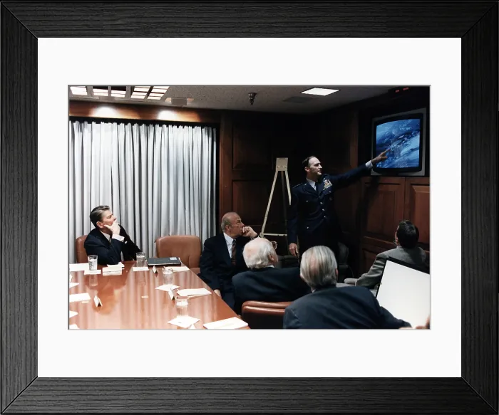 Framed Print : Ronald Reagan. President Reagan (L) and Secretary of State George P. Shultz (center) in a briefing with the National Security Council Staff on the Libya Bombing. Washington, D.C Framed Print : Ronald Reagan. President Reagan (L) and Secretary of State George P. Shultz (center) in a briefing with the National Security Council Staff on the Libya Bombing. Washington, D.C