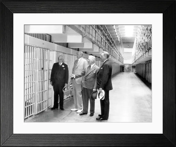 Framed Print : The newly built Alcatraz Federal Penitentiary receives official approval. From left: San Francisco Mayor Angelo Rossi, Attorney General Homer S. Cummings, Warden James A