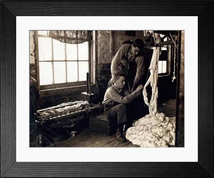 Framed Print : Cotton Mill. Boy at warping machine. Been there 2 years. Clyde Cotton Mill, Newton, North Carolina. Photo by Lewis Hine Wickes, Dec 1908