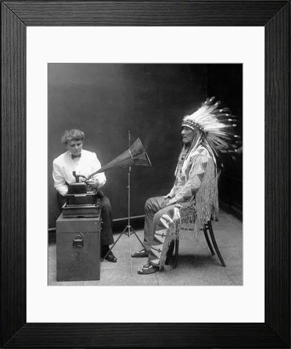 Framed Print : Native American having his voice recorded. Original caption reads: Piegan Indian, Mountain Chief, having his voice recorded by ethnologist Frances Densmore, 1916