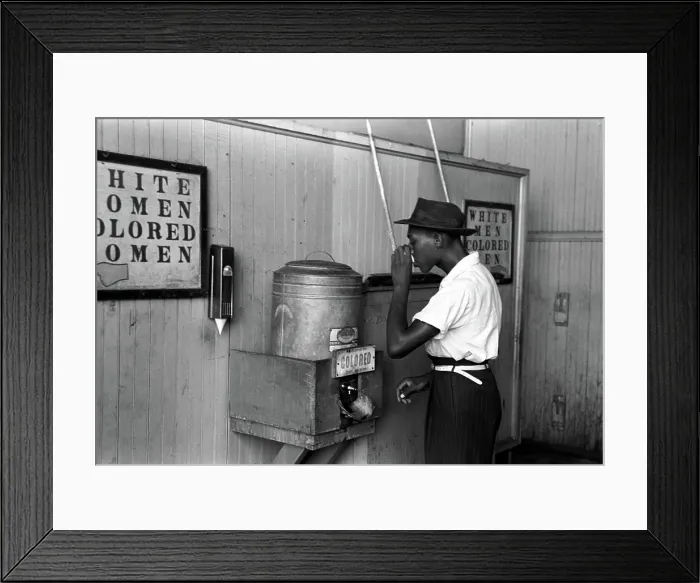 Framed Print : Original caption reads: Negro drinking at colored water cooler in streetcar terminal, by Lee Russell, Oklahoma City, Oklahoma, July, 1939 Framed Print : Original caption reads: Negro drinking at colored water cooler in streetcar terminal, by Lee Russell, Oklahoma City, Oklahoma, July, 1939