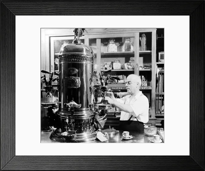 Framed Print : Little Italy, Espresso is poured in an Italian-American cafe on MacDougal Street, photo by Marjory Collins, 1942
