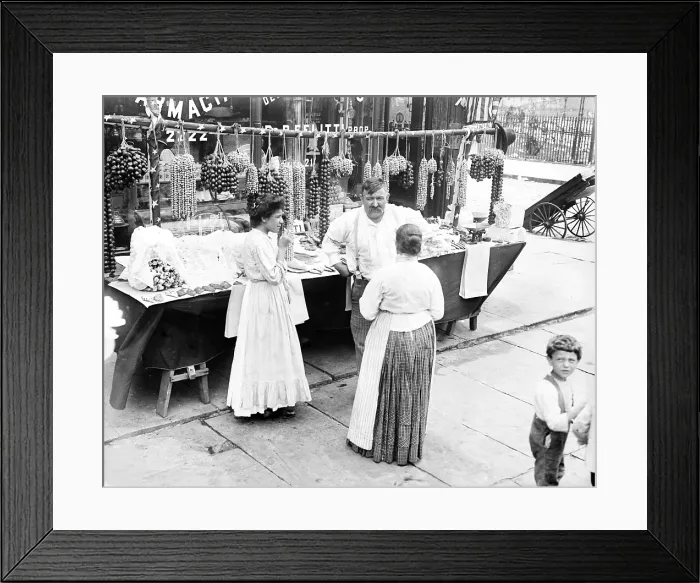 Framed Print : Little Italy - vendor with wares displayed during a festival, New York, ca. 1930s