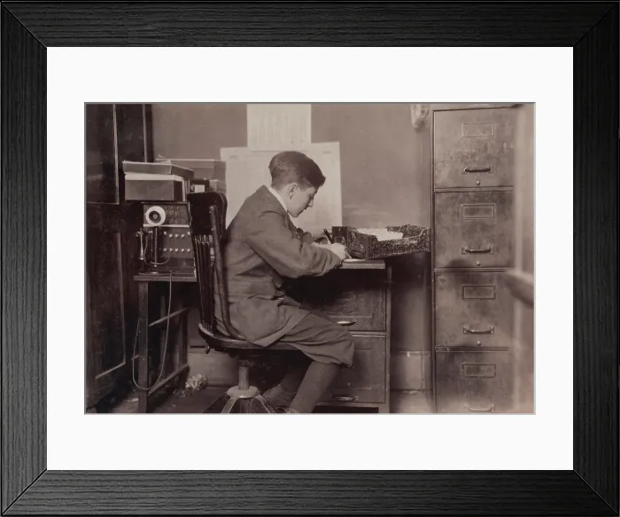 Framed Print : Young office boy, working for J.J. O'Brien and Sons on East 23 Street, over 16 years old, New York City, photograph by Lewis Wickes Hine, January, 1917 Framed Print : Young office boy, working for J.J. O'Brien and Sons on East 23 Street, over 16 years old, New York City, photograph by Lewis Wickes Hine, January, 1917