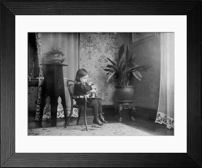 Framed Print : Child putting a Campbell Kid to sleep, photograph by Lewis Wickes Hine, March, 1912 Framed Print : Child putting a Campbell Kid to sleep, photograph by Lewis Wickes Hine, March, 1912
