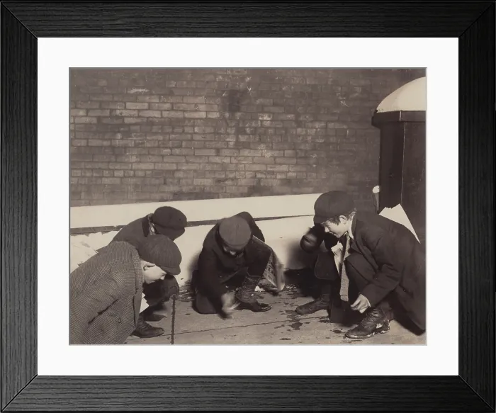 Framed Print : Children playing a dice game, from original caption: playing craps in the jail alley at 10 P.M. Albany, New York, photograph by Lewis Wickes Hine, February, 1910