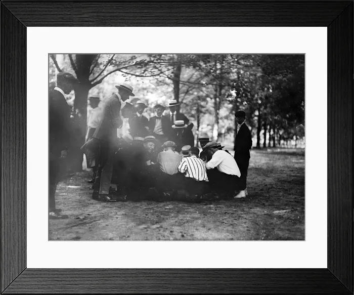 Framed Print : Playing a dice game, original title: Crap game, photograph circa 1909-1920 Framed Print : Playing a dice game, original title: Crap game, photograph circa 1909-1920