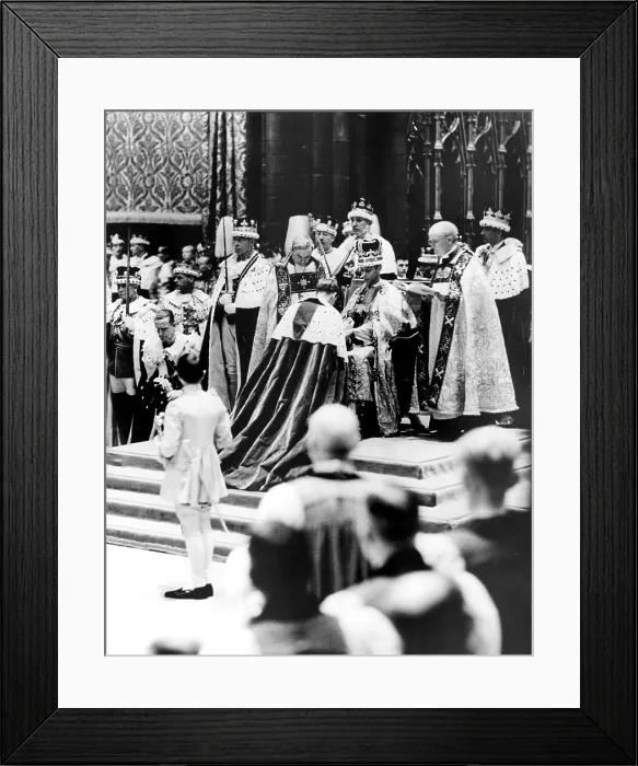 Framed Print : Peers, present in Westminster Abbey, London, May 12, on the occasion of the coronation of Queen Elizabeth I, who pays homage to King George VI, shown seated on his throne Framed Print : Peers, present in Westminster Abbey, London, May 12, on the occasion of the coronation of Queen Elizabeth I, who pays homage to King George VI, shown seated on his throne