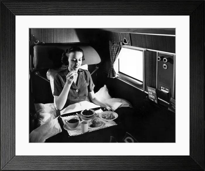 Framed Print : A passenger eats breakfast on United Airline's Douglas Mainliner Sleeper airplane from Chicago to San Francisco, 1937. Courtesy: CSU Archives / Everett Collection Framed Print : A passenger eats breakfast on United Airline's Douglas Mainliner Sleeper airplane from Chicago to San Francisco, 1937. Courtesy: CSU Archives / Everett Collection