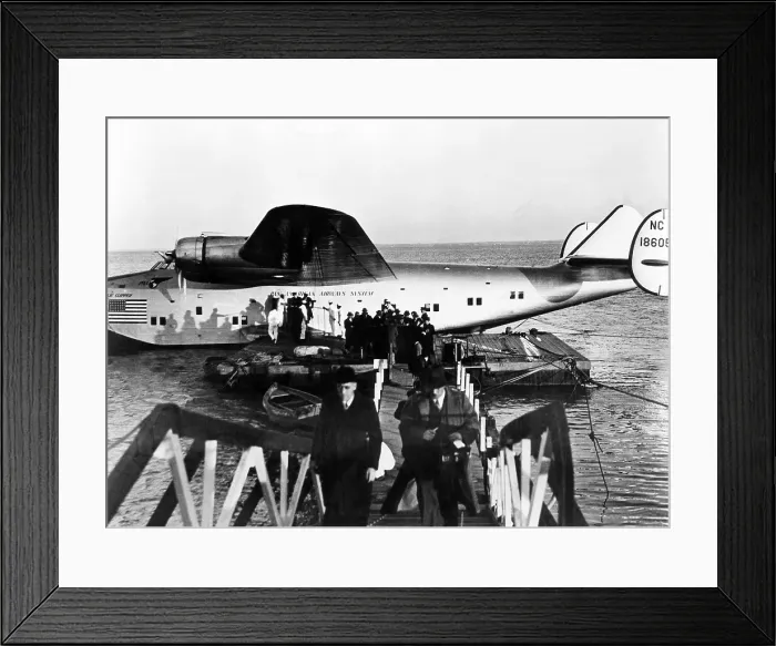 Framed Print : The first passengers to cross the Atlantic leave Pan American's Dixie Clipper airplane in Lisbon, Portugal. The plane took off from Port Washington, New York, 1939