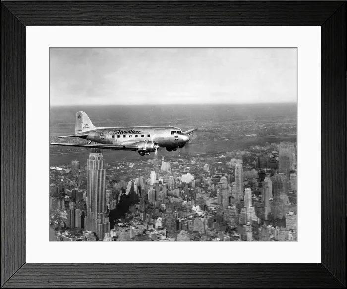 Framed Print : A United Airlines plane flies over Manhattan, 1937. Courtesy: CSU Archives / Everett Collection