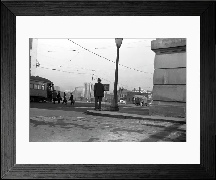 Framed Print : Man standing on corner, 6:30 a.m. in front of Union Station, Omaha, Nebraska, photograph by John Vachon, October, 1938 Framed Print : Man standing on corner, 6:30 a.m. in front of Union Station, Omaha, Nebraska, photograph by John Vachon, October, 1938