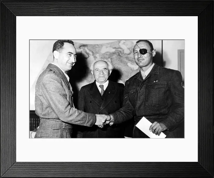 Framed Print : Israeli General Moshe Dayan (right) shakes hands with General Mordechai Marcleff. Prime Minister David Ben-Gurion looks on, 1960. Courtesy: CSU Archives / Everett Collection