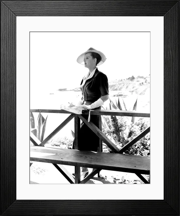 Framed Print : NOW, VOYAGER, Bette Davis, in a suit by Orry-Kelly, 1942