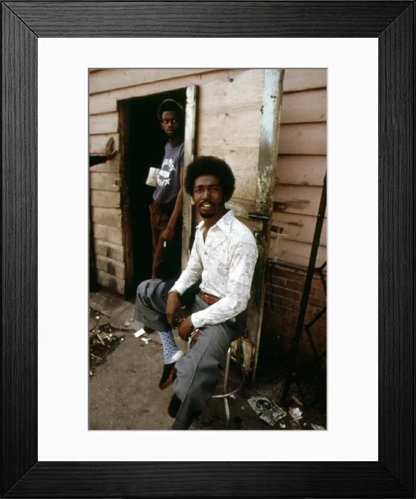 Framed Print : 1970s America. Two young men at the entrance to a pool hall on the West Side of Chicago, ca. 1973