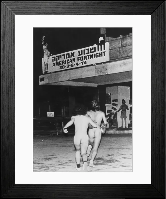 Framed Print : Two Israeli streakers running through downtown Tel Aviv, Israel, 1974.. Courtesy: CSU Archives  /  Everett Collection