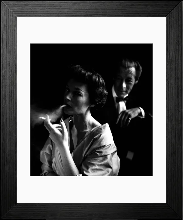 Framed Print : Lilli Palmer, with husband Rex Harrison in background, photograph by Toni Frissell, circa 1950