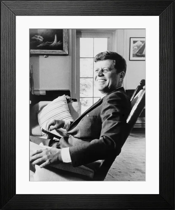Framed Print : President John F. Kennedy in rocking chair on his 43rd birthday. May 29, 1963